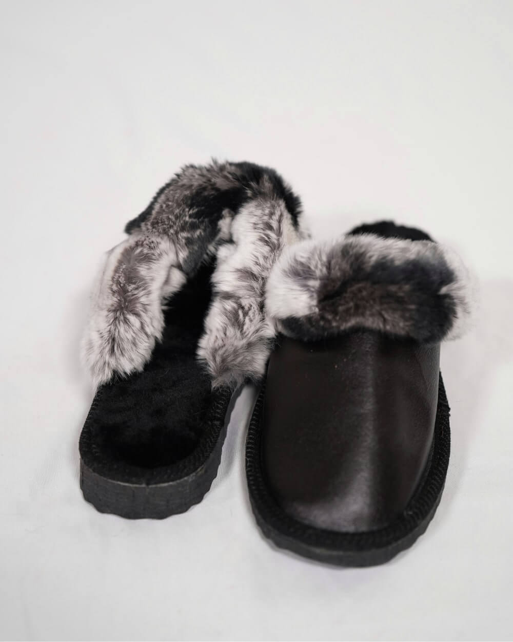 Sheepskin Wool Leather Fur Slippers Black with Gray Top showcasing their luxurious design and sheepskin wool interior.