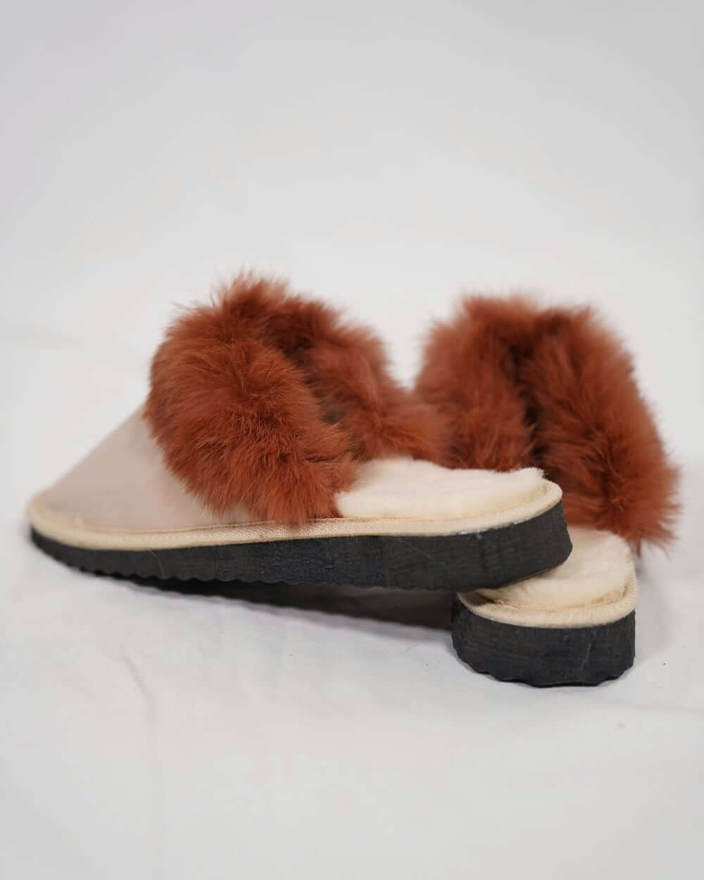 Sheepskin Wool Leather Fur Slippers Beige Powder with brown fur trim on a white background.