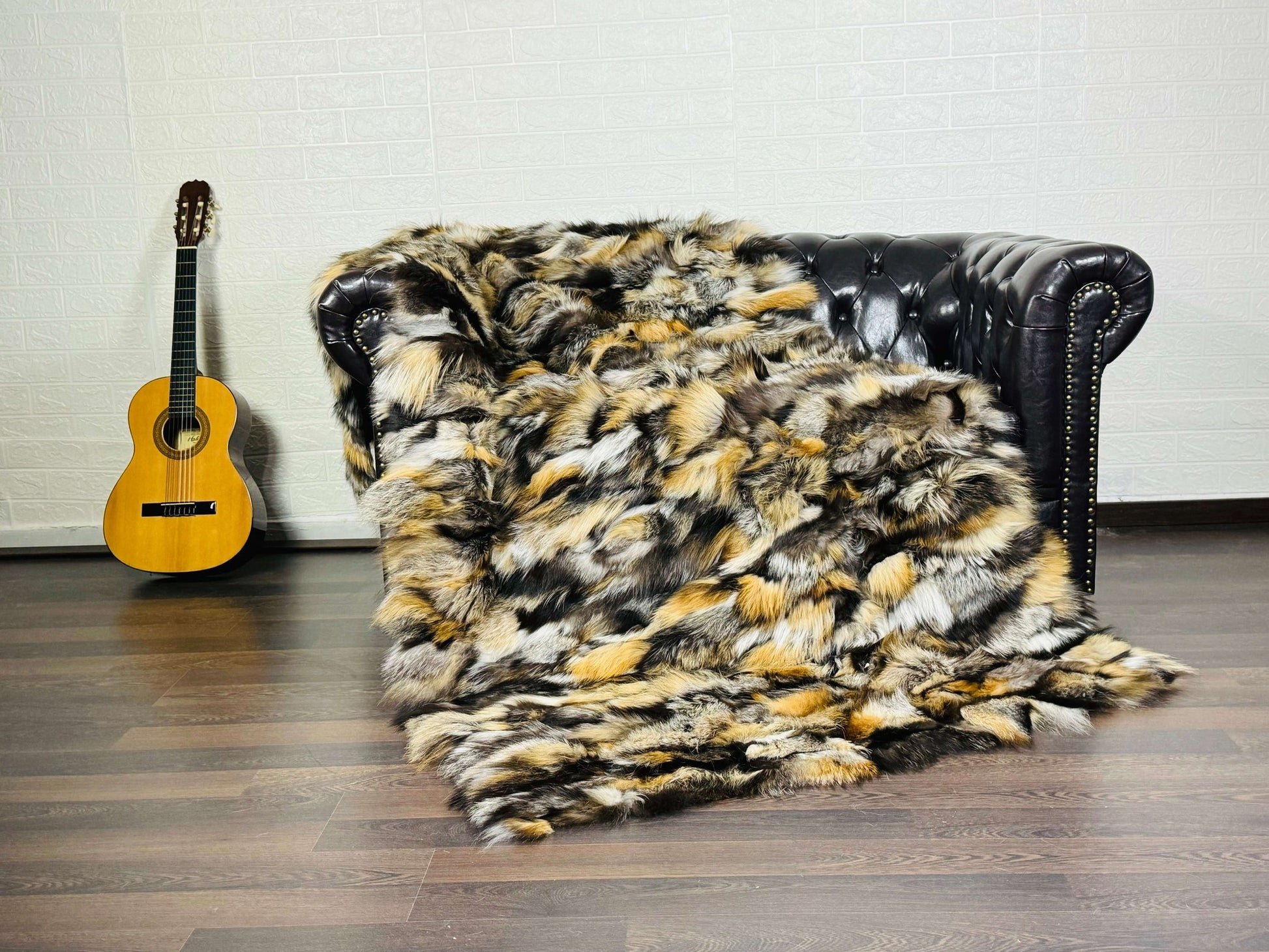 Fox Fur Blanket Throw Gross Natural - Tatifurs displayed on a couch with warm tones and unique color variations.