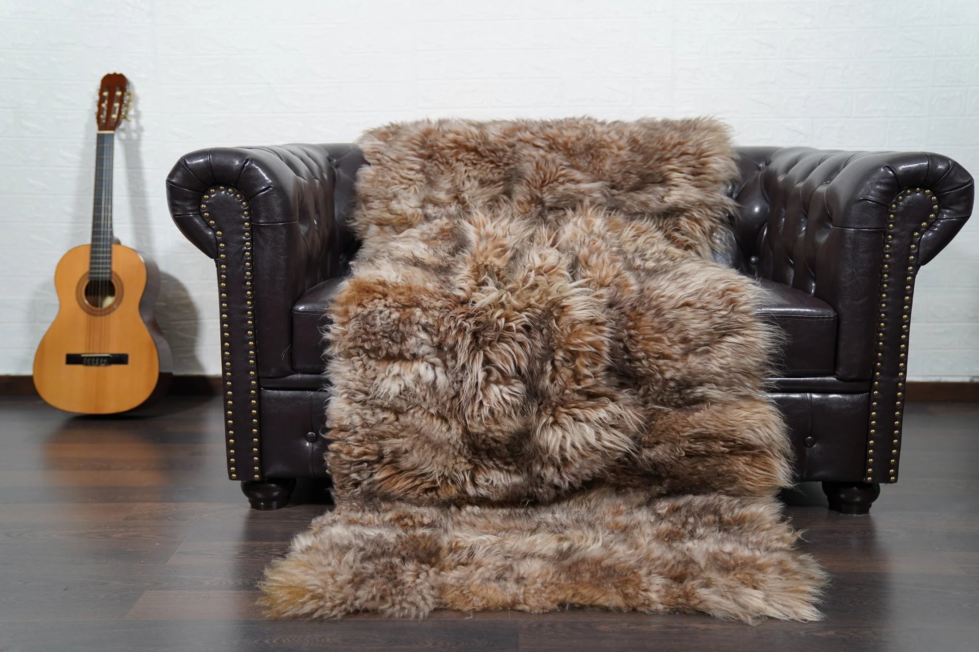 Alpaca throw blanket iceberg shown draped over bed displaying cool luminous natural iceberg alpaca wool tone across full blanket surface — Greek craftsmanship, TatiFurs
