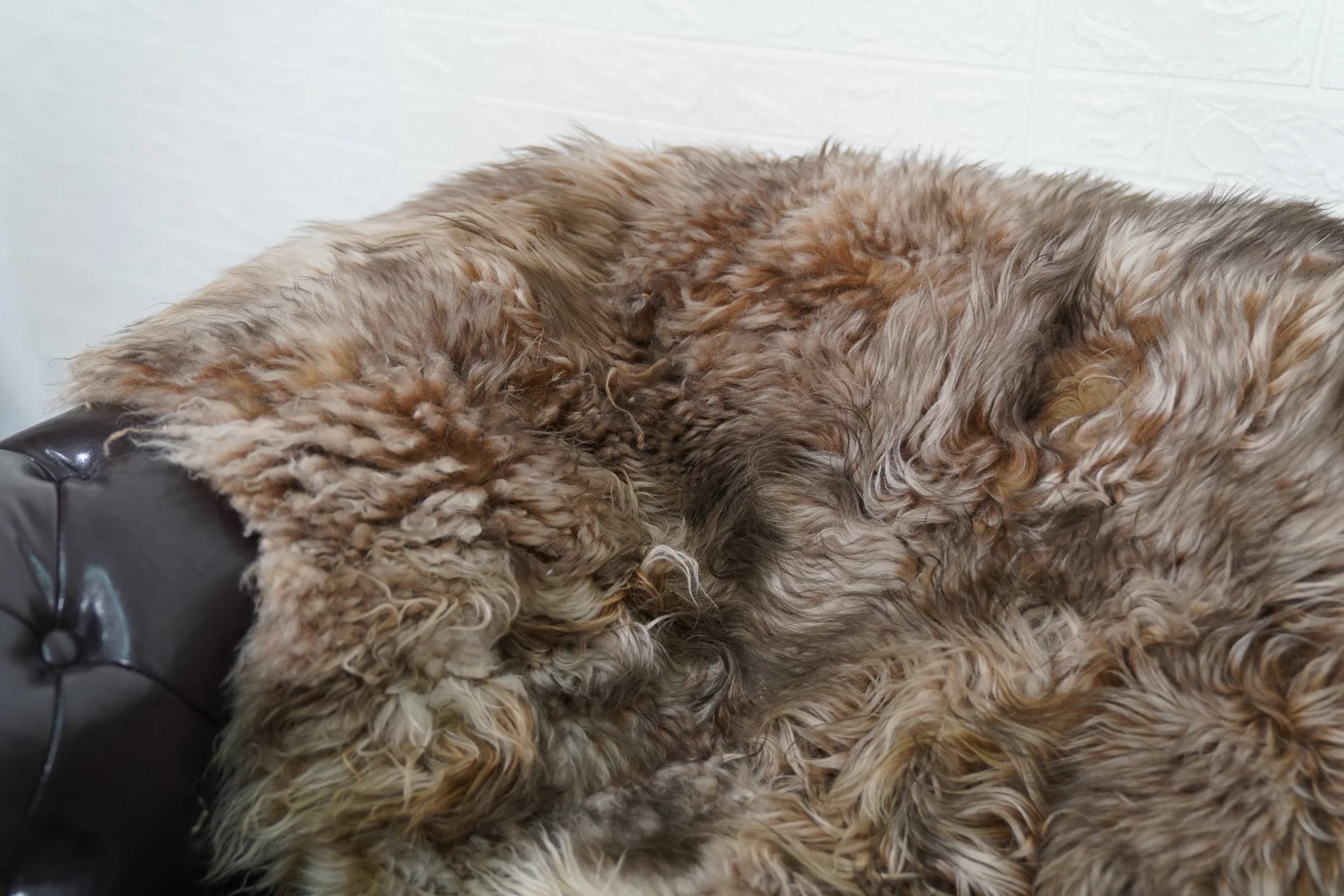 Alpaca throw blanket iceberg close-up texture showing natural alpaca wool fiber softness and cool luminous iceberg tone — Greek craftsmanship, TatiFurs
