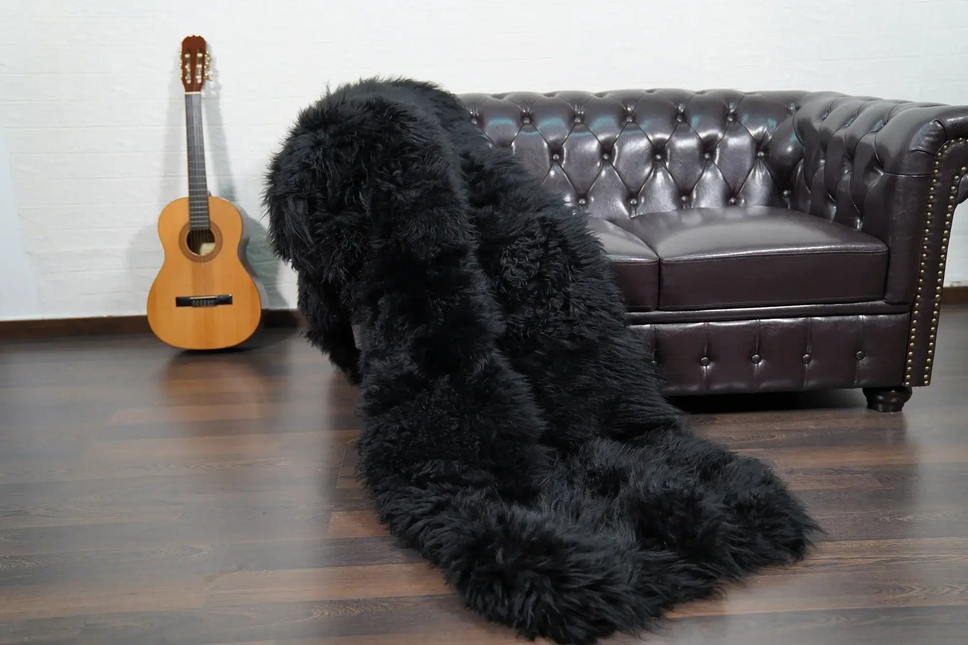 Alpaca throw blanket black folded showing velvet cotton backing and black alpaca wool face — Greek craftsmanship, TatiFurs
