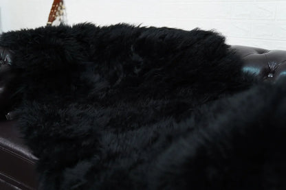 Alpaca throw blanket black wool shown full surface displaying consistent deep commanding black tone and soft alpaca texture — Greek craftsmanship, TatiFurs
