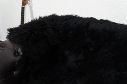 Alpaca throw blanket black velvet cotton backing detail showing smooth warm reverse against commanding black alpaca wool face — Greek craftsmanship, TatiFurs

