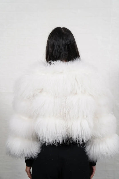 Alpaca fur jacket white shown from the side displaying cropped above waist bomber silhouette and horizontal leather framed luminous white alpaca rows — Greek craftsmanship, TatiFurs
