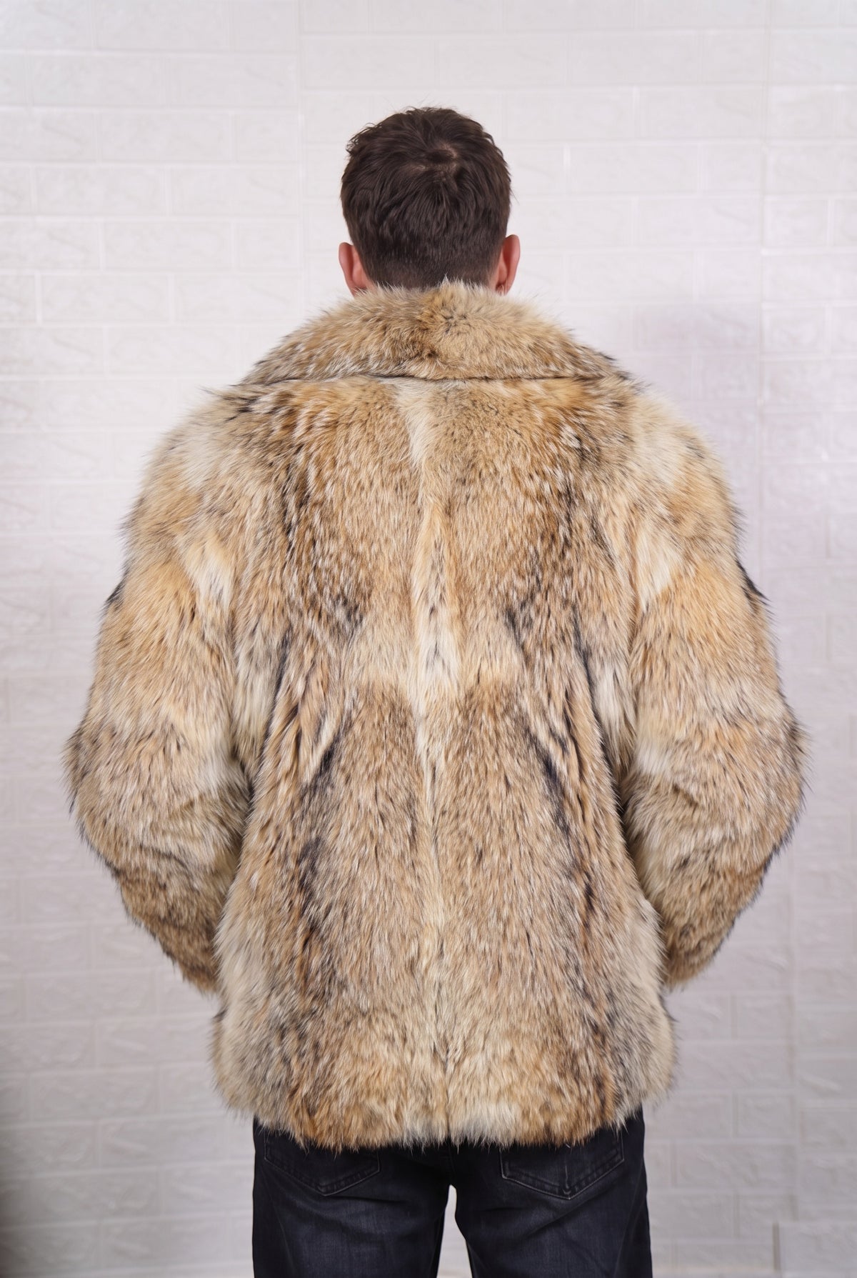 coyote fur jacket men shown from the back displaying full mid-length silhouette and consistent warm golden tan with cream and dark-tipped guard hairs pile — Greek craftsmanship, TatiFurs