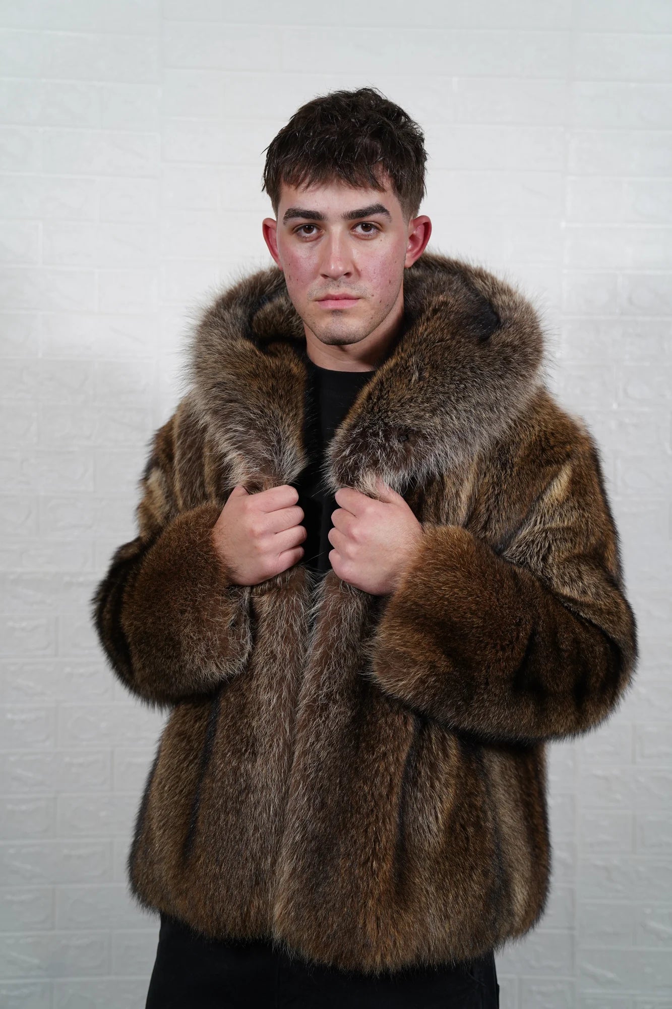 Raccoon fur jacket men natural brown shown from the side displaying below hip silhouette and dramatic natural brown raccoon pile drape — Greek craftsmanship, TatiFurs
