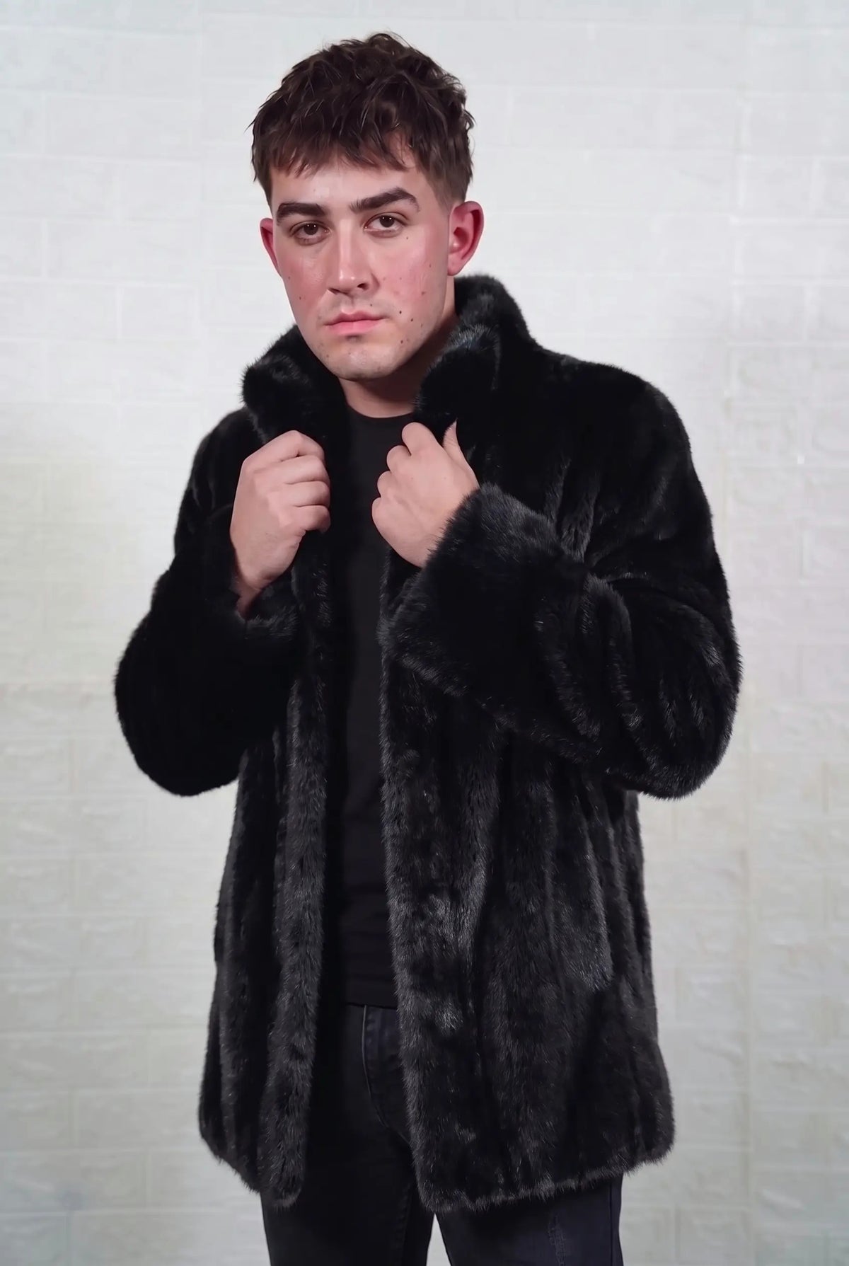 mink fur jacket men black full skin mid length — front view with both hands on the stand collar, glossy jet black mink with a rich, even sheen — TatiFurs