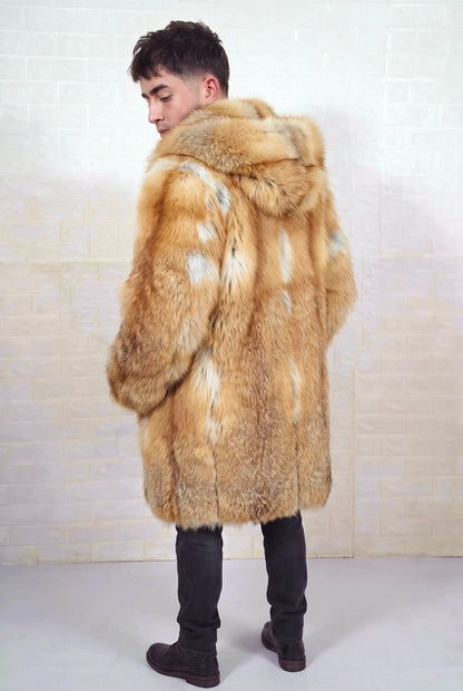 fox fur coat men natural golden back three-quarter view showing long silhouette and fur hood in natural golden fox, warm amber-gold with cream and pale silver highlights fox fur — Greek craftsmanship, TatiFurs