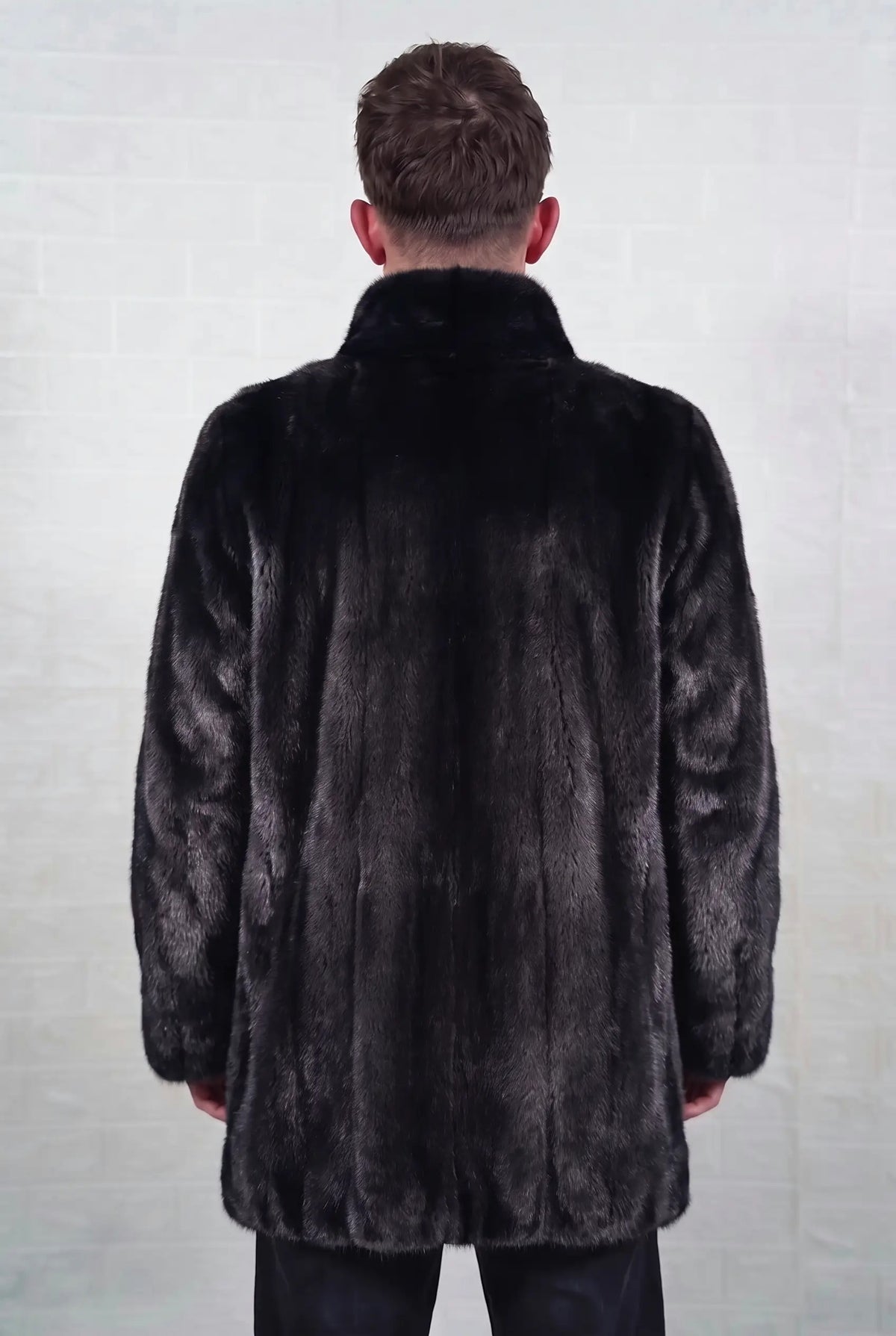 mink fur jacket men black shown from the back displaying the full mid length silhouette and even glossy jet black mink with a rich, even sheen — Greek craftsmanship, TatiFurs