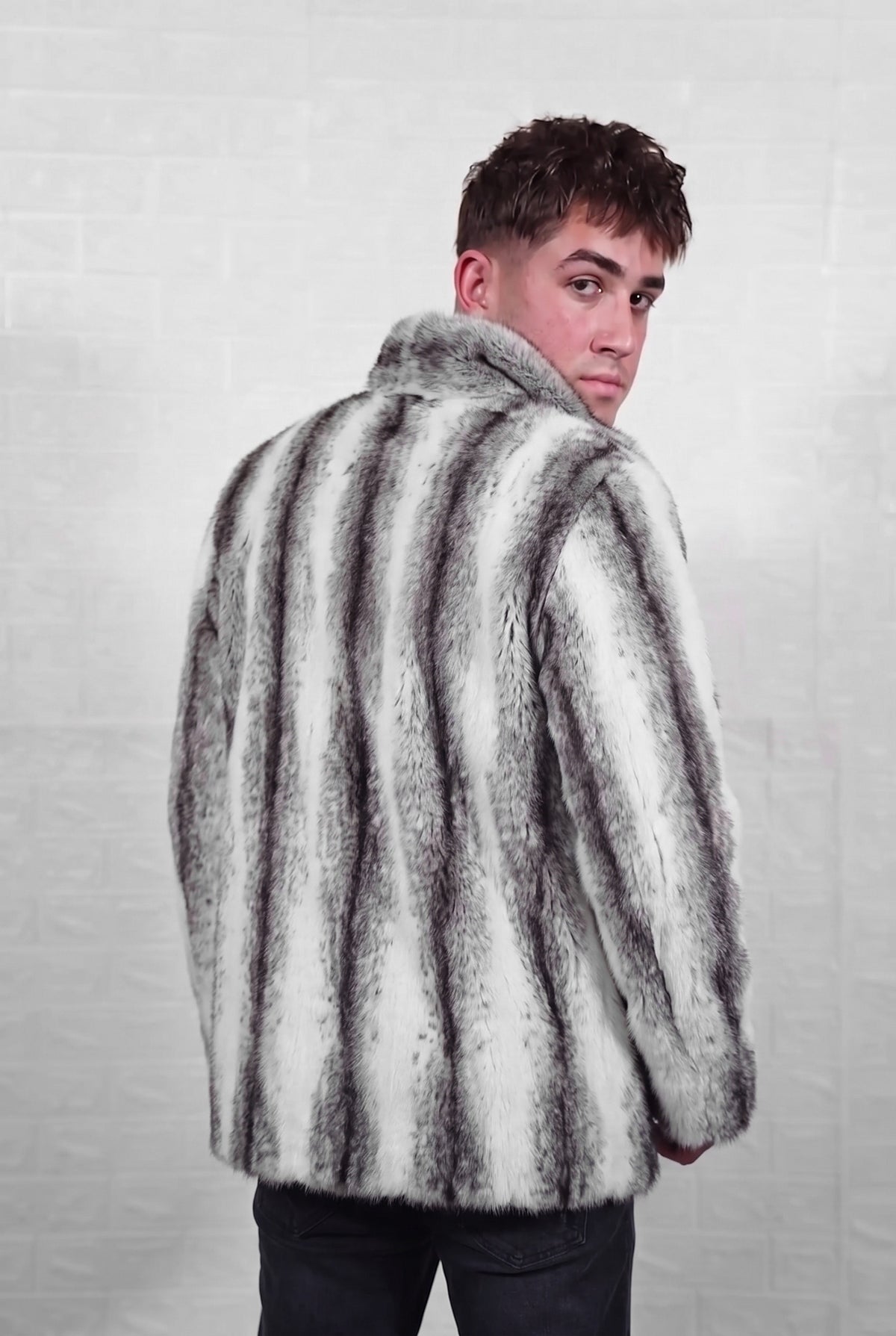 mink fur jacket men black cross three-quarter back view looking over the shoulder, snow white mink with soft feathered charcoal cross stripes down every pelt — Greek craftsmanship, TatiFurs