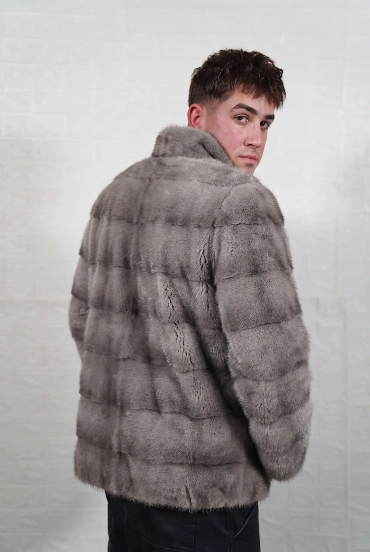 mink fur jacket men natural gray three-quarter back view looking over the shoulder, cool natural gray mink with a silver sheen and soft darker bands — Greek craftsmanship, TatiFurs