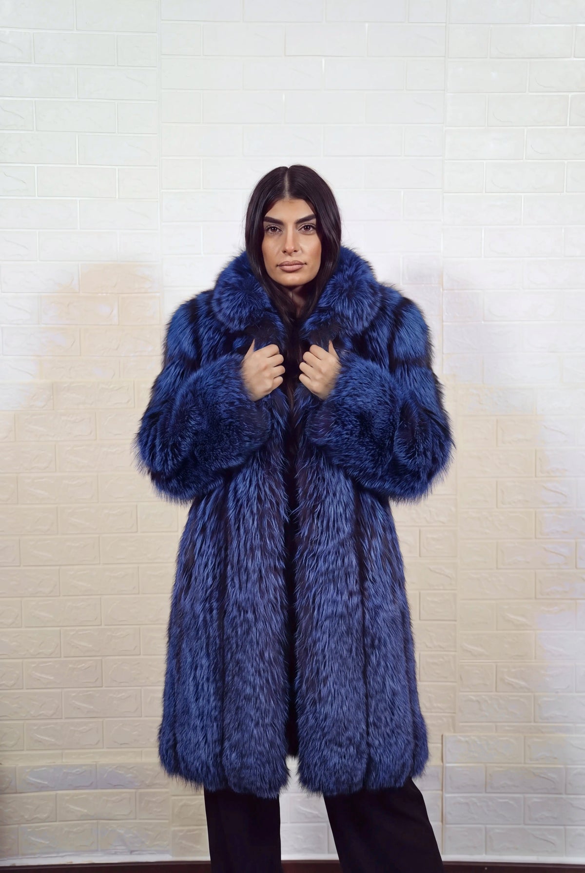fox fur coat long blue black front view with both hands on the fur collar showing electric blue over jet black fox fur — TatiFurs