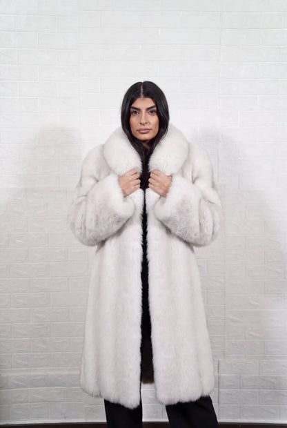 fox fur coat long blue natural front view with both hands on the fur collar showing natural blue fox, ivory-white underfur with a soft blue-grey veil at the tips fox fur — TatiFurs