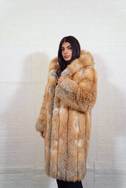 fox fur coat long golden natural three-quarter view displaying long silhouette, fur hood and natural golden fox, warm amber-gold with cream and pale silver highlights fox fur — TatiFurs