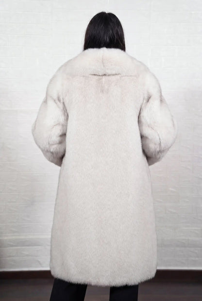fox fur coat long blue natural shown from the back displaying full long silhouette and consistent natural blue fox, ivory-white underfur with a soft blue-grey veil at the tips pile — Greek craftsmanship, TatiFurs