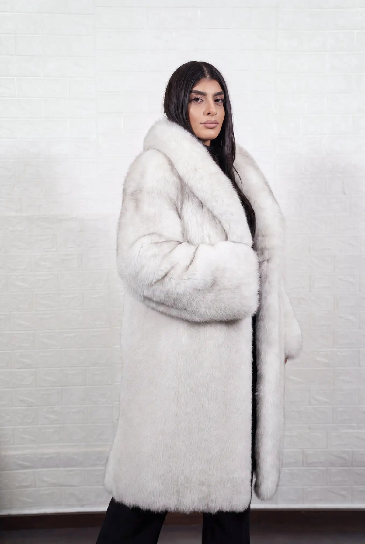 fox fur coat long blue natural side view with the fur collar turned up showing long coat and natural blue fox, ivory-white underfur with a soft blue-grey veil at the tips fox fur — Greek craftsmanship, TatiFurs