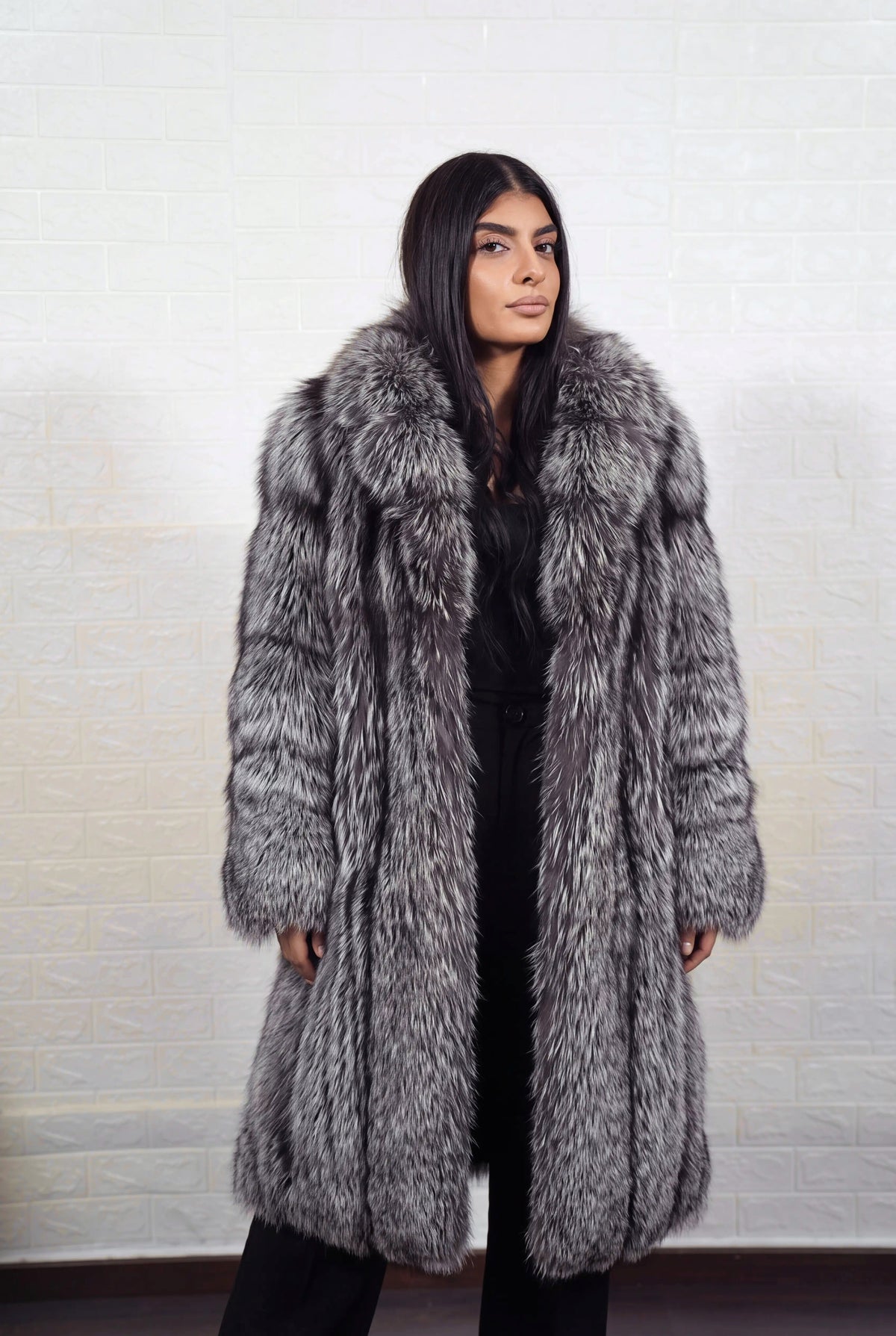 fox fur coat long silver natural side view with the fur collar turned up showing long coat and natural silver fox, black base with silver-white tips fox fur — Greek craftsmanship, TatiFurs