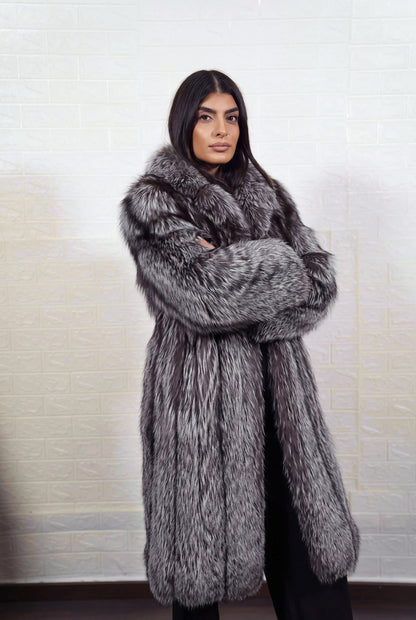 fox fur coat long silver natural front view with arms crossed displaying long coat and natural silver fox, black base with silver-white tips fox fur pile depth — TatiFurs