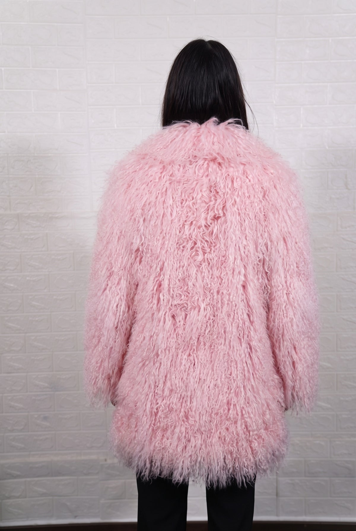 Mongolian coat pink shown from the back displaying full mid-thigh silhouette and consistent soft blush pink curly wool surface — Greek craftsmanship, TatiFurs
