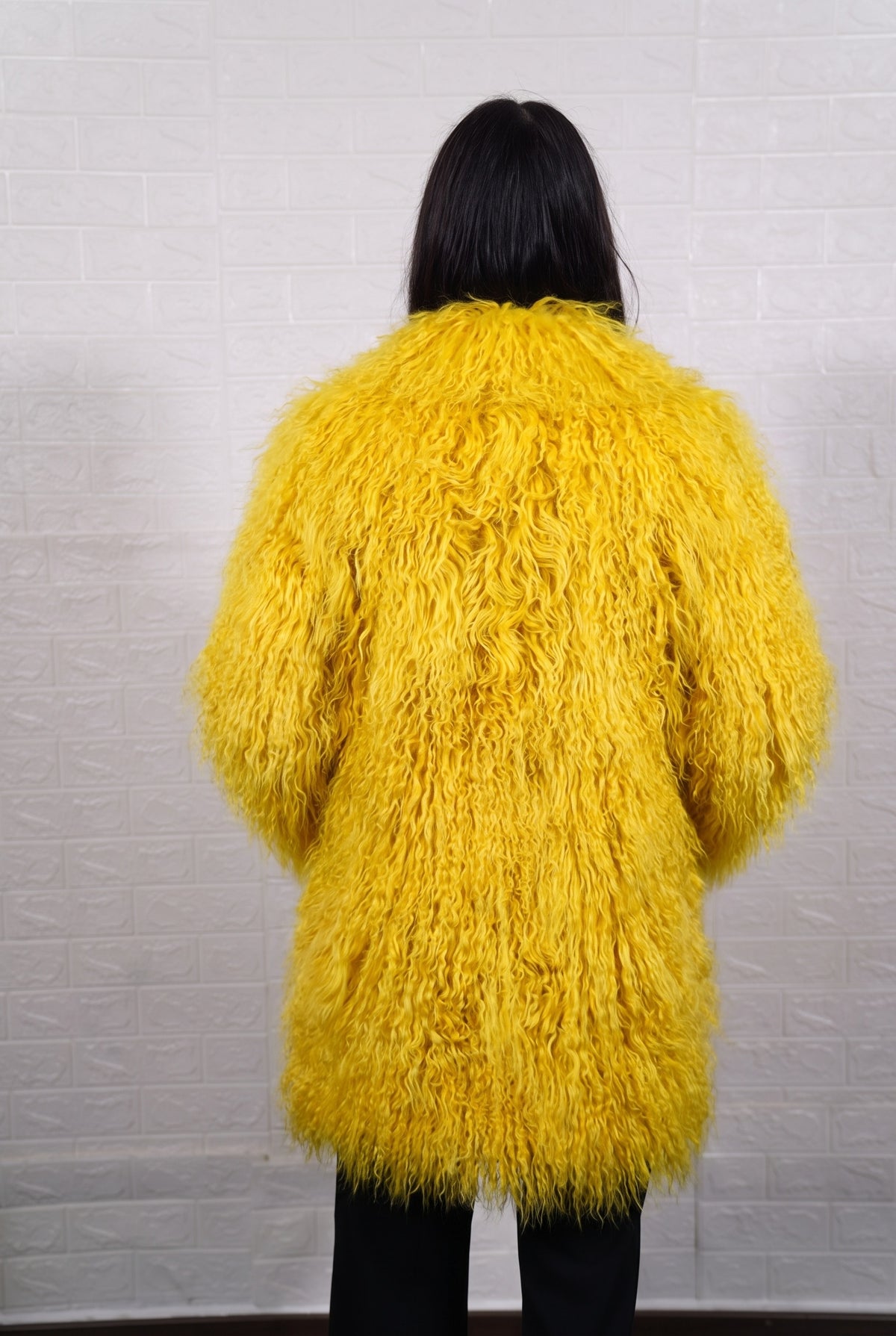 Mongolian coat yellow shown from the back displaying full mid-thigh silhouette and consistent bright sunshine yellow curly wool surface — Greek craftsmanship, TatiFurs