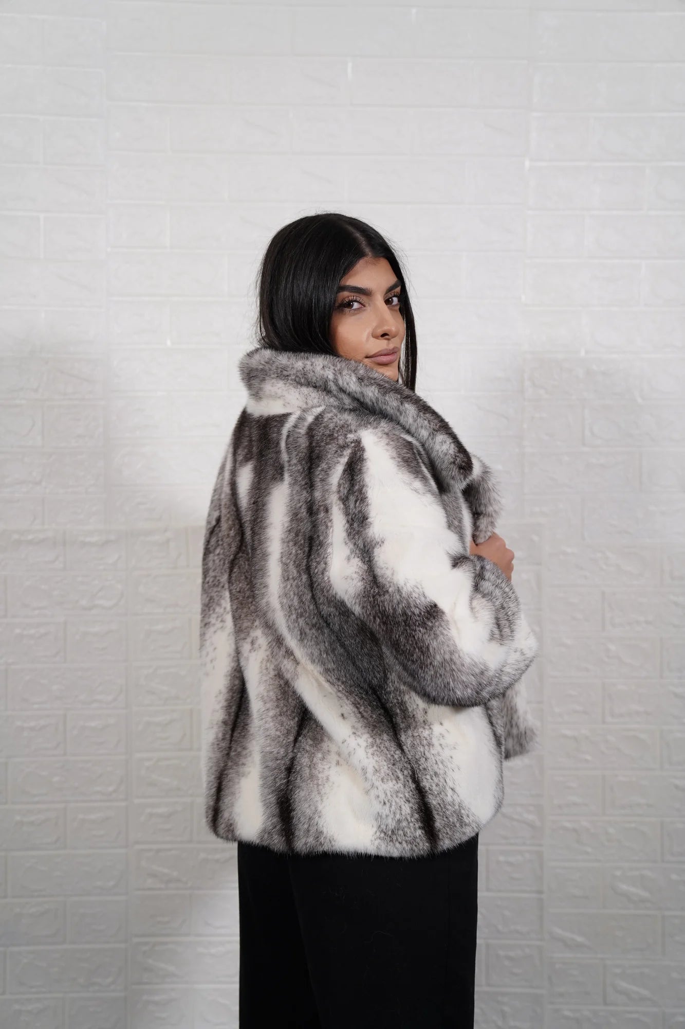 Mink fur jacket cross collar close-up showing fur collar graded against dynamic black white cross cut mink body — Greek craftsmanship, TatiFurs
