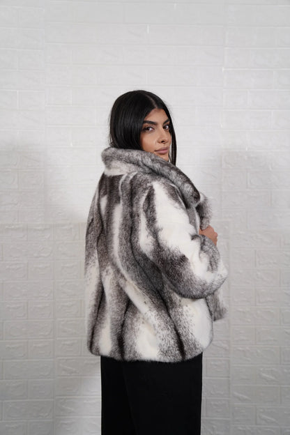 Mink fur jacket cross collar close-up showing fur collar graded against dynamic black white cross cut mink body — Greek craftsmanship, TatiFurs

