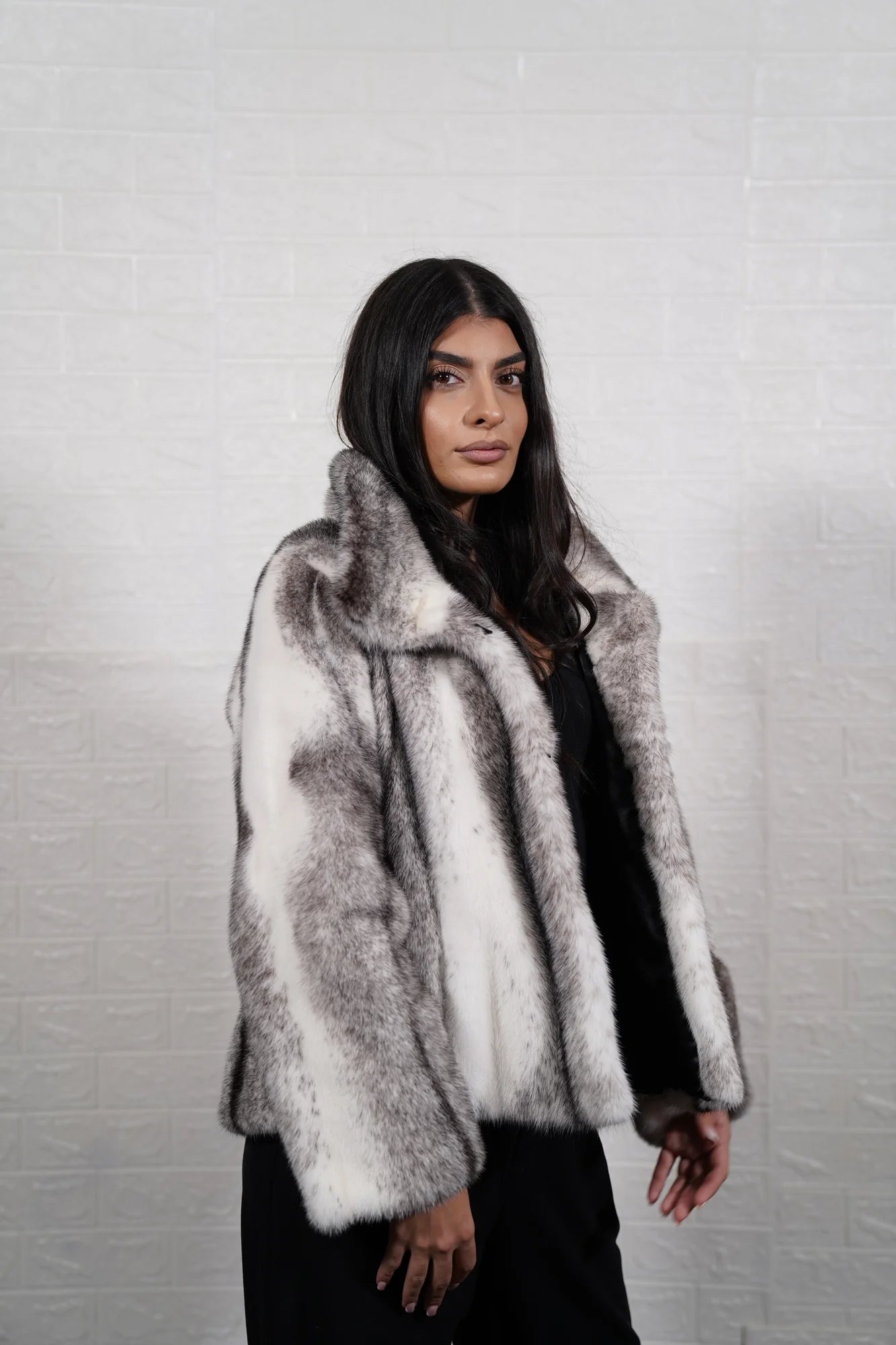 Mink fur jacket cross button closure detail showing clean front line on black white cross cut mink jacket — Greek craftsmanship, TatiFurs
