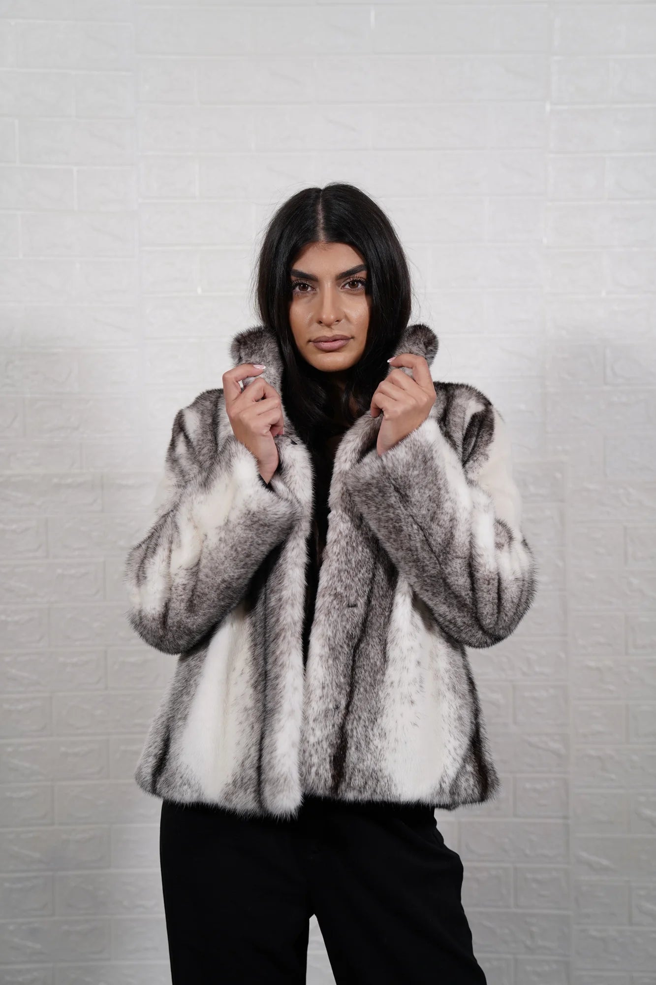 Mink fur jacket cross women shown full length from front displaying fur collar and hip level cross cut black white mink silhouette — Greek craftsmanship, TatiFurs
