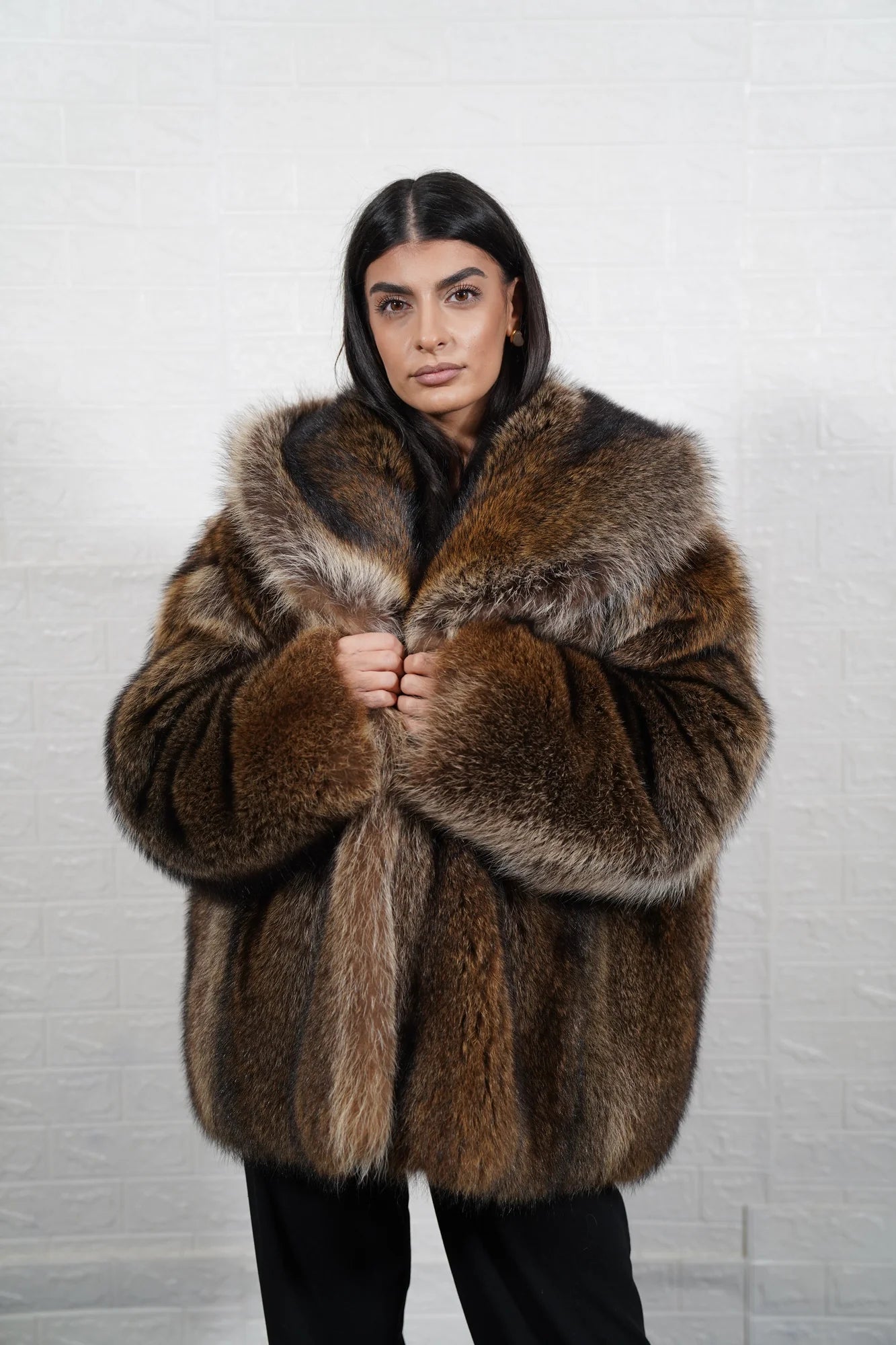 Raccoon fur jacket natural brown close-up texture showing full skin raccoon long pile depth and warm natural brown tonal variation — Greek craftsmanship, TatiFurs
