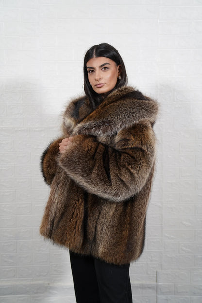 Raccoon fur jacket natural brown shown from the side displaying below hip silhouette and dramatic natural brown raccoon pile drape — Greek craftsmanship, TatiFurs
