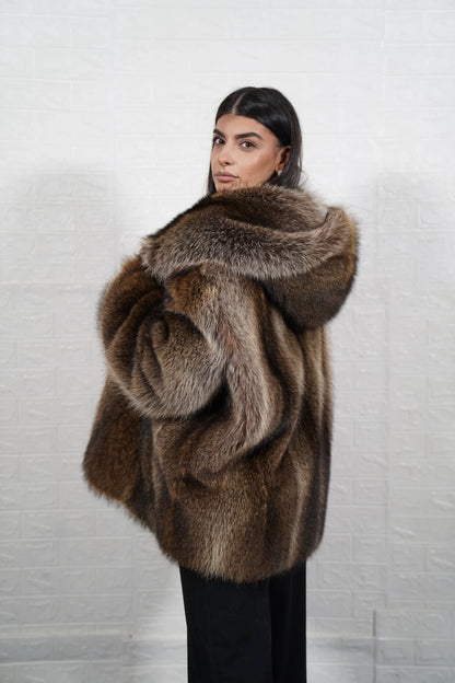 Raccoon fur jacket natural brown women shown full length from front displaying hooded silhouette and button closure in full skin natural raccoon — Greek craftsmanship, TatiFurs
