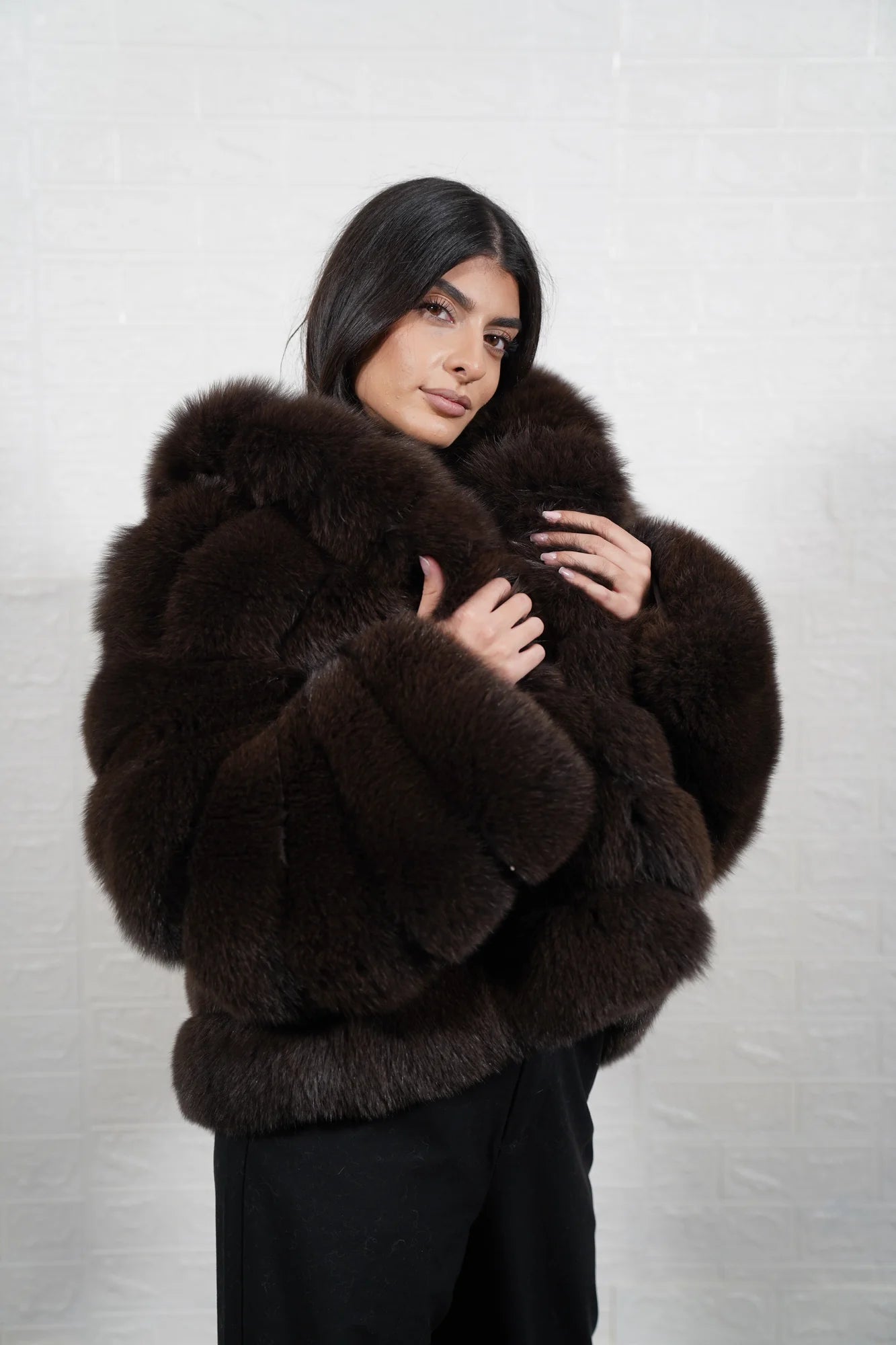 Fox fur jacket brown shown from the side displaying hip level silhouette and horizontal rabbit trim framed warm brown fox rows — Greek craftsmanship, TatiFurs
