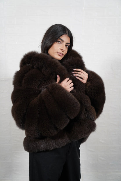 Fox fur jacket brown shown from the side displaying hip level silhouette and horizontal rabbit trim framed warm brown fox rows — Greek craftsmanship, TatiFurs

