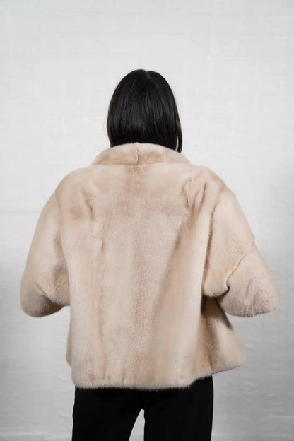 Mink fur jacket pastel ivory collar close-up showing precise pelt matching between collar and shoulder skins in soft luminous pastel ivory mink — Greek craftsmanship, TatiFurs
