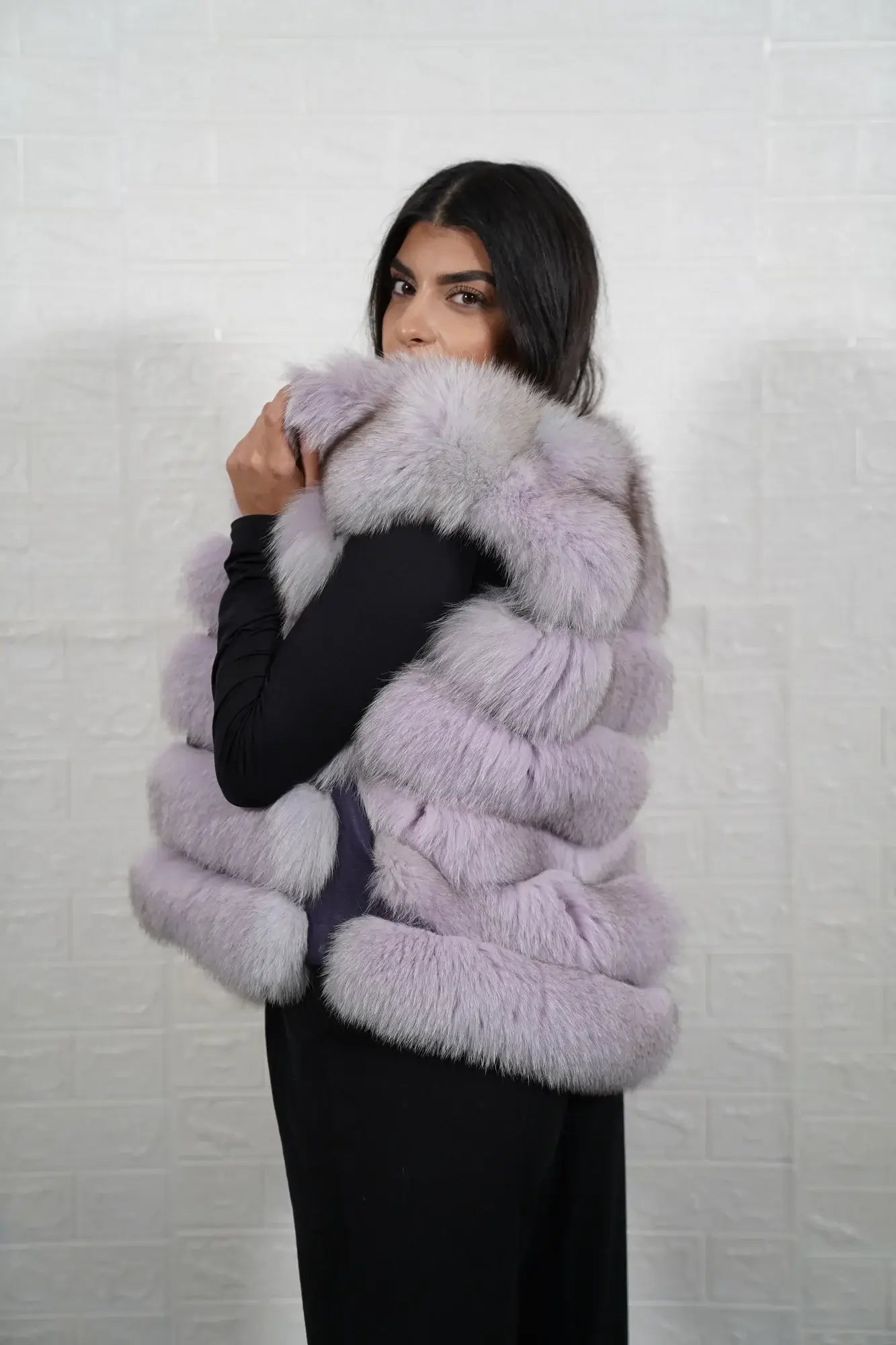 Fox fur vest purple shown from the side displaying hip level silhouette and horizontal leather framed bold purple fox rows — Greek craftsmanship, TatiFurs
