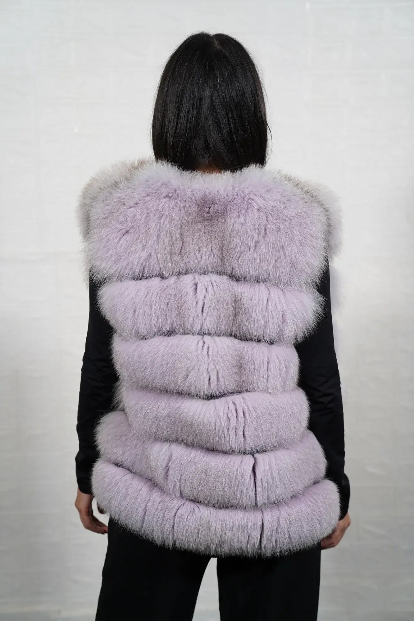 Fox fur vest purple shown from the back displaying full hip level silhouette and horizontal leather strip construction across purple fox rows — Greek craftsmanship, TatiFurs
