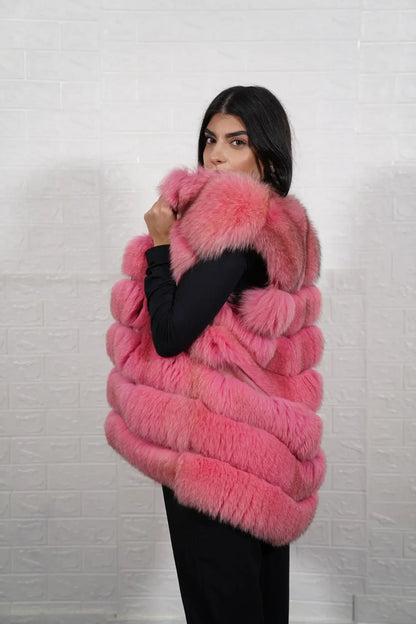 Fox fur vest pink shown from the side displaying hip level silhouette and horizontal leather framed soft pink fox rows — Greek craftsmanship, TatiFurs
