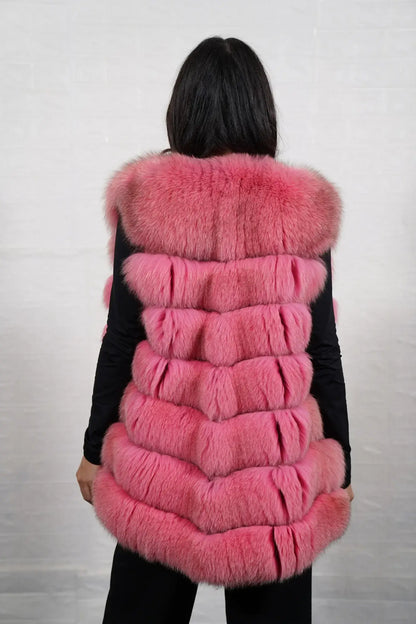 Fox fur vest pink shown from the back displaying full hip level silhouette and horizontal leather strip construction across pink fox rows — Greek craftsmanship, TatiFurs
