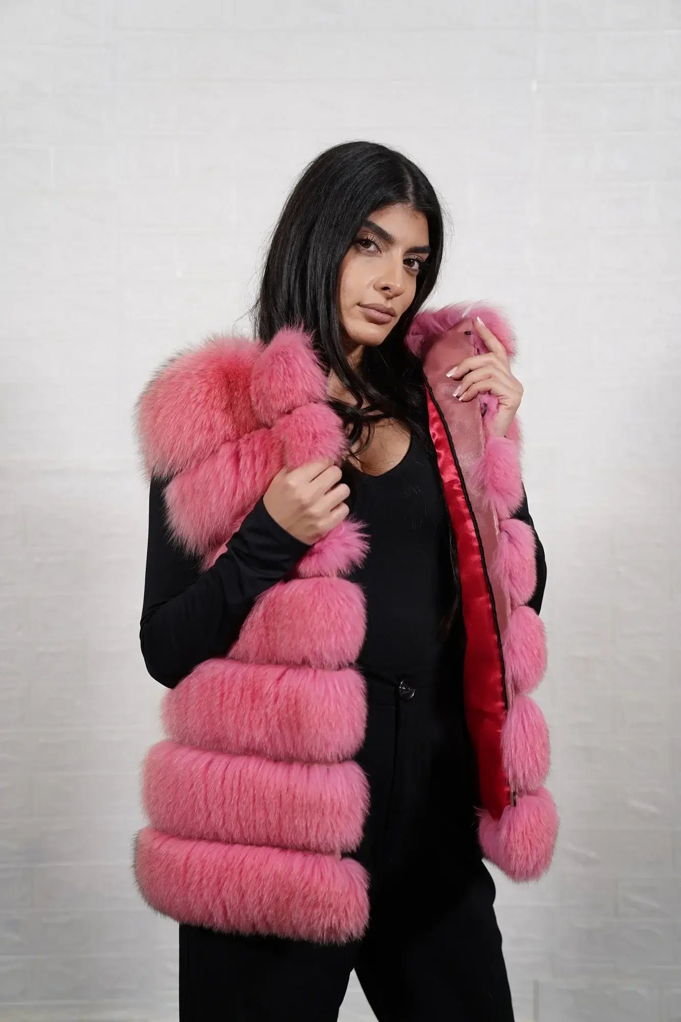 Fox fur vest pink close-up texture showing full skin pink fox long pile and horizontal leather strip construction between fur rows — Greek craftsmanship, TatiFurs
