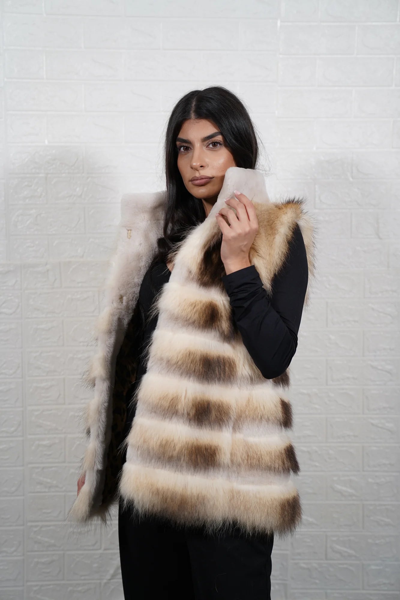 Finn raccoon vest sheepskin lines displaying full skin Finnish raccoon horizontal rows with off white sheepskin strips and sheepskin collar below hip silhouette — Greek craftsmanship, TatiFurs
