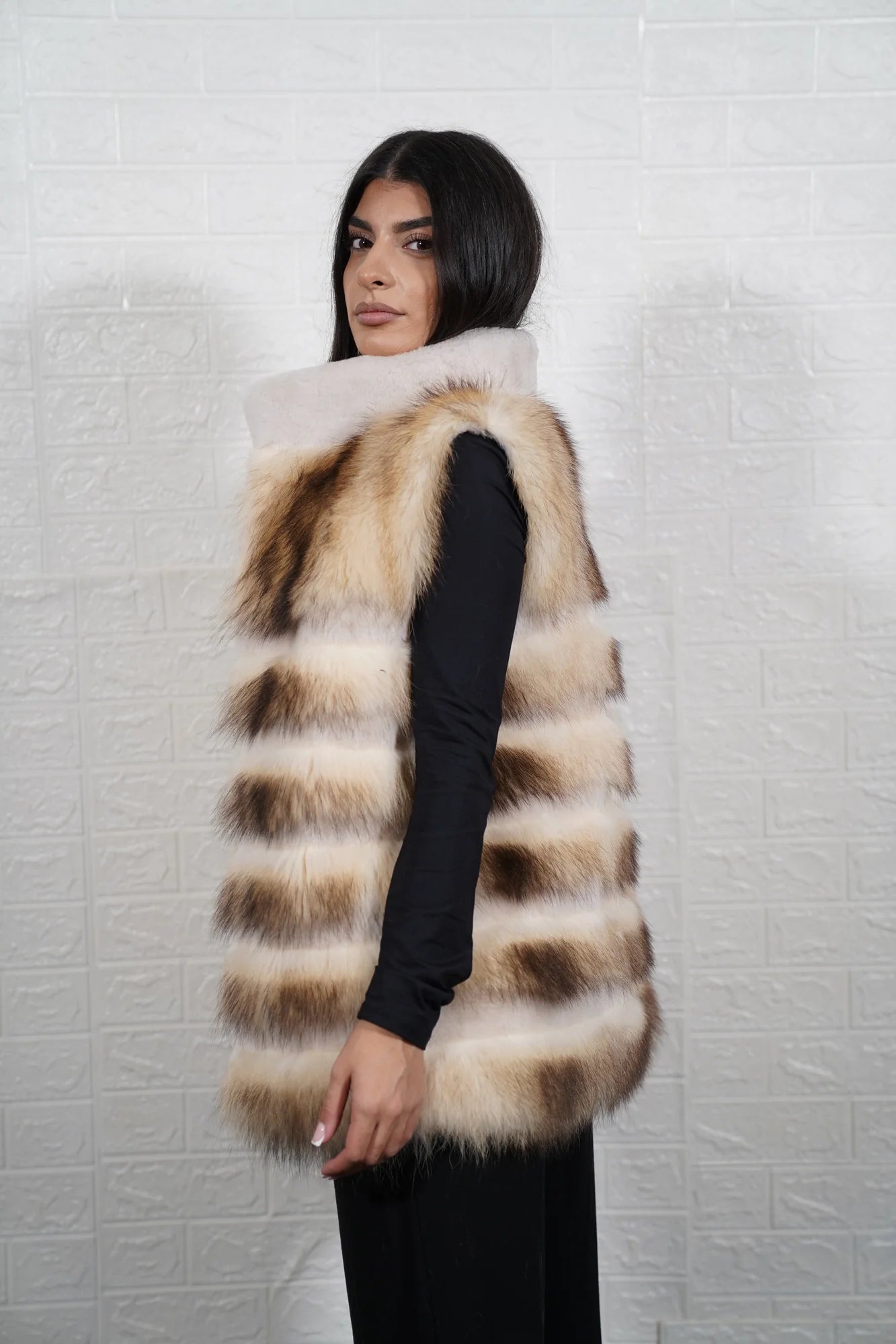 Finn raccoon vest sheepskin lines shown from the side displaying below hip silhouette and horizontal sheepskin framed Finnish raccoon rows — Greek craftsmanship, TatiFurs
