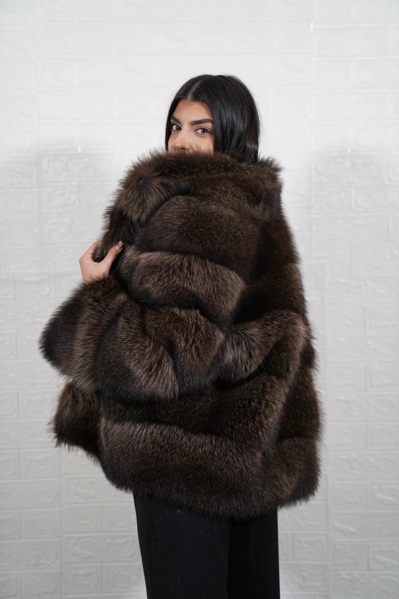 Raccoon fur jacket brown close-up texture showing natural brown raccoon pile depth and warm tonal variation across colour matched panels — Greek craftsmanship, TatiFurs
