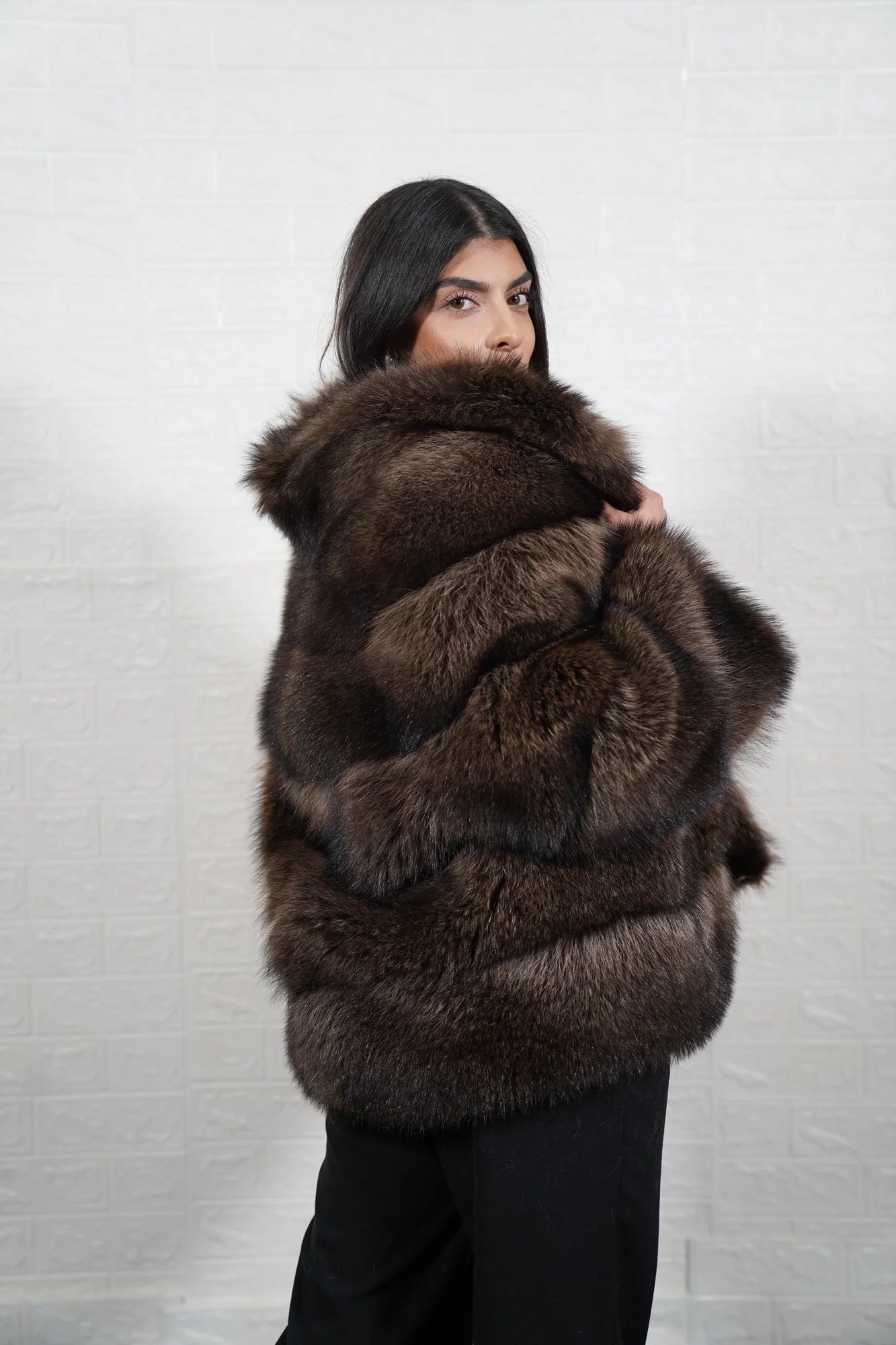 Raccoon fur jacket brown shown from the back displaying full below hip silhouette and consistent natural brown raccoon panel surface — Greek craftsmanship, TatiFurs
