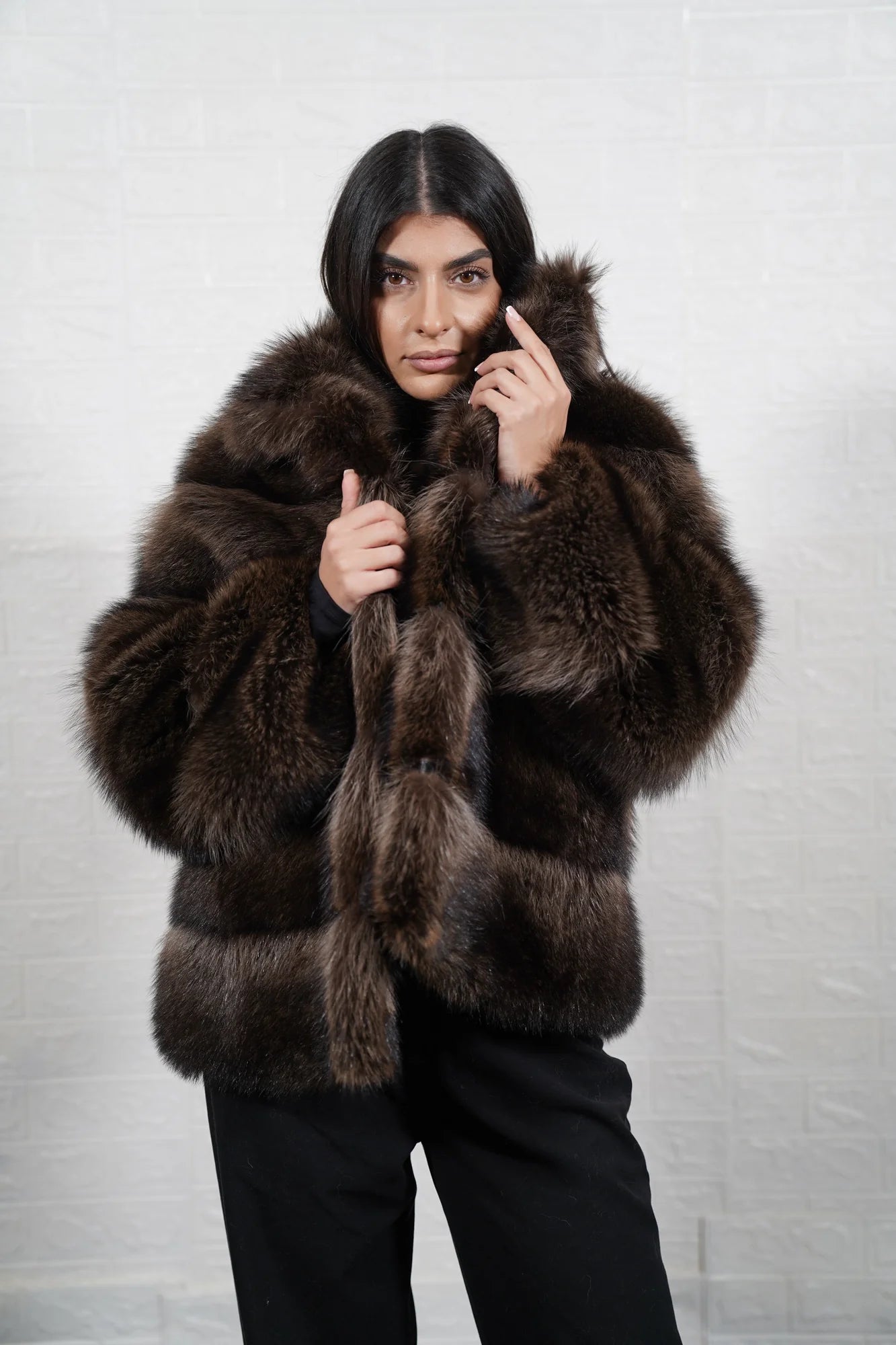 Raccoon fur jacket brown collar close-up showing precise panel matching between collar and shoulder panels in warm natural brown raccoon — Greek craftsmanship, TatiFurs
