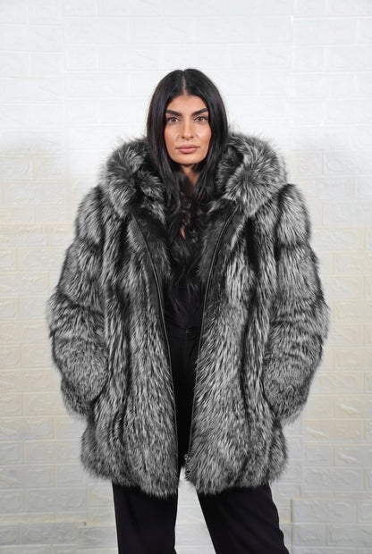 fox fur jacket silver natural full skin mid length — front view, hood down, hands in pockets, TatiFurs