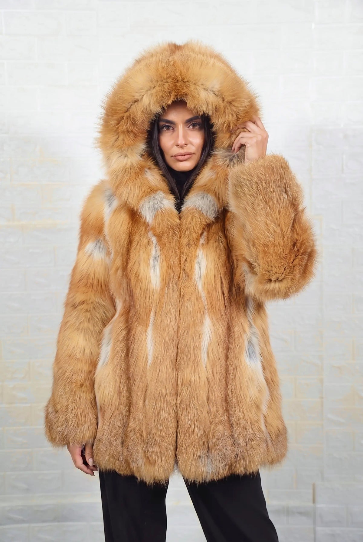 fox fur jacket golden natural worn with the fur hood up framing the face in natural golden fox, warm amber-gold with cream and pale silver highlights fox fur — TatiFurs