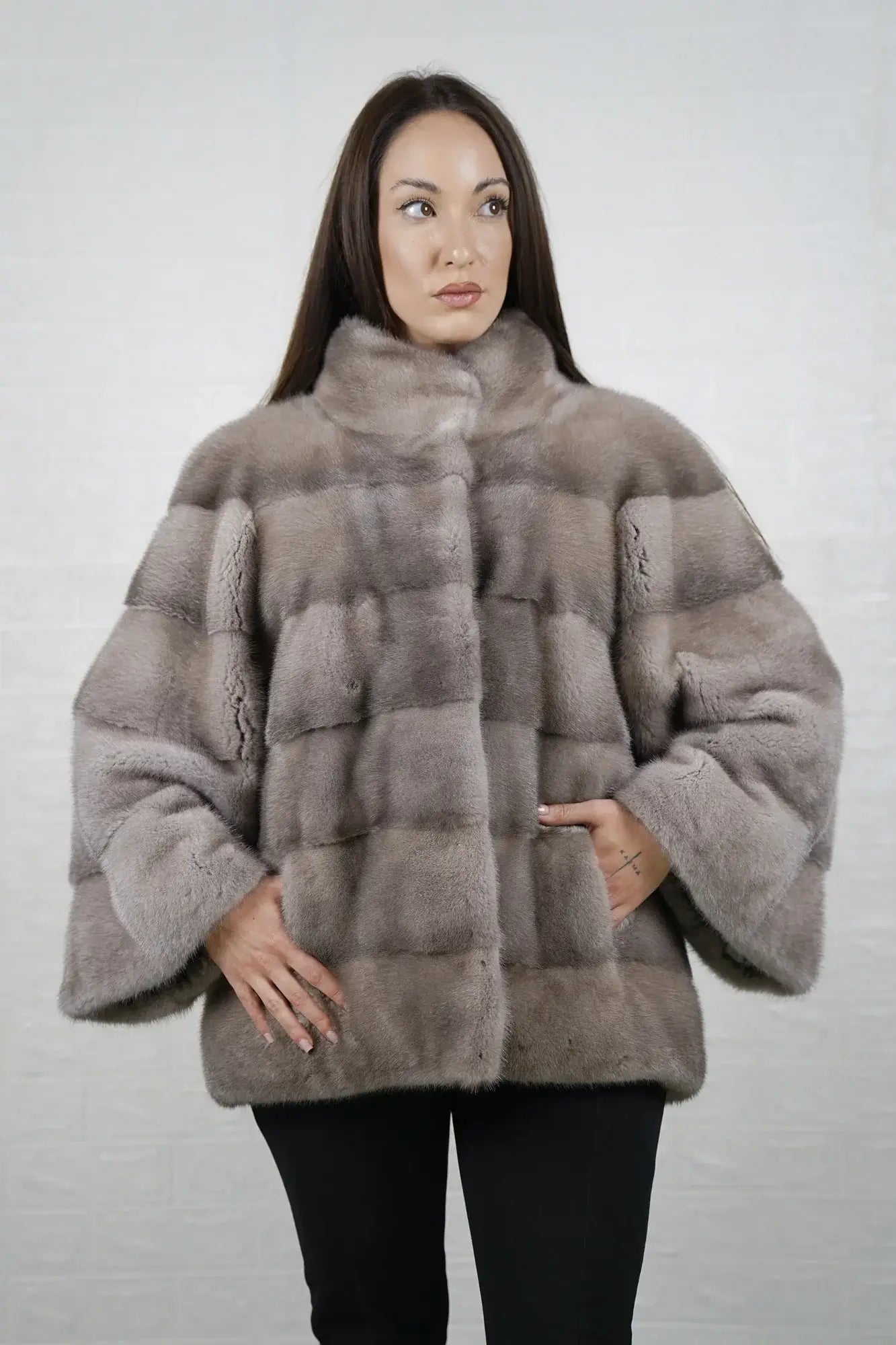 Mink fur jacket silver close-up texture showing skin on skin pelt flow and cool luminous silver mink depth — Greek craftsmanship, TatiFurs
