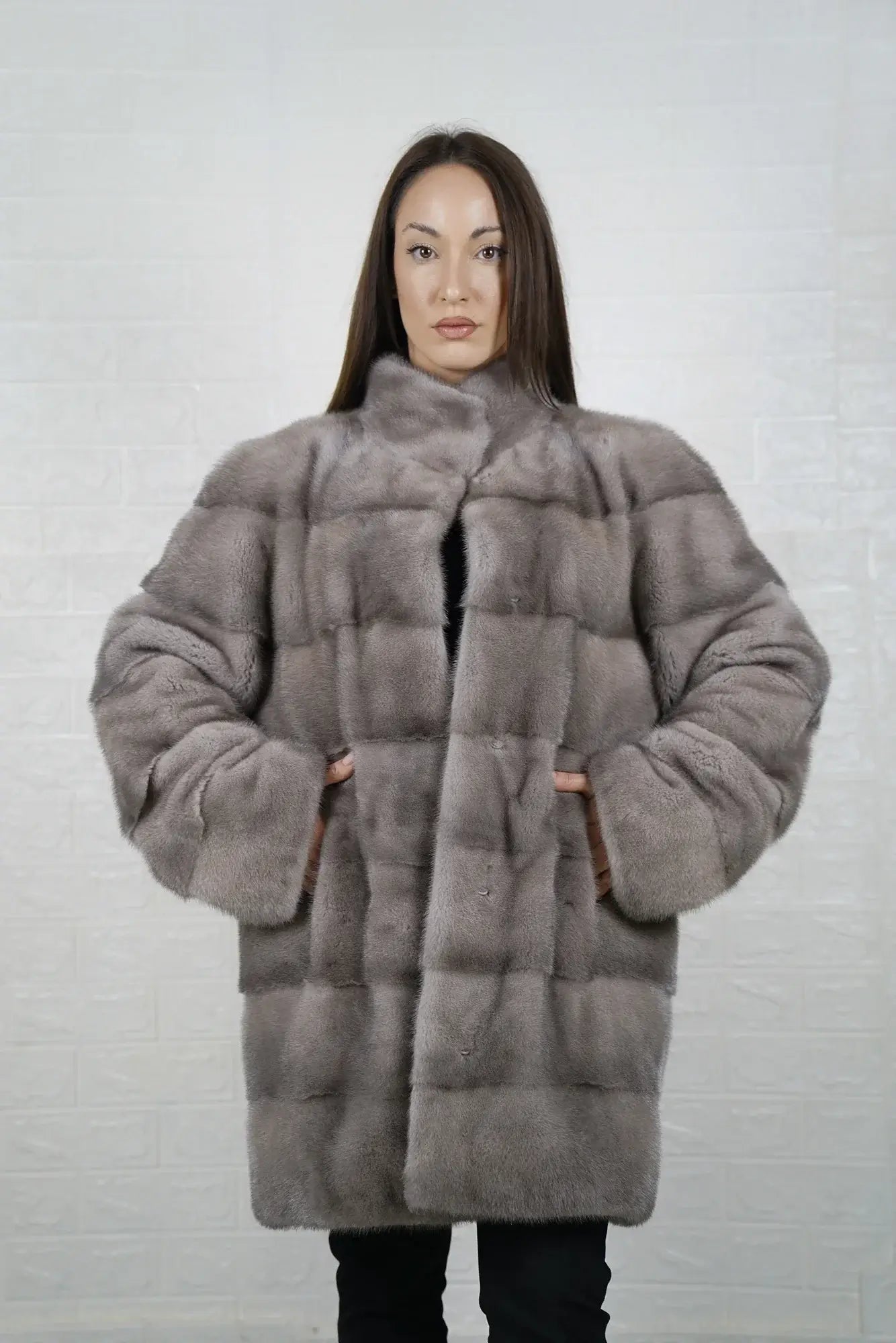 Mink fur coat silver shown from the side displaying above the knee silhouette and luminous silver mink drape from collar to hem — Greek craftsmanship, TatiFurs
