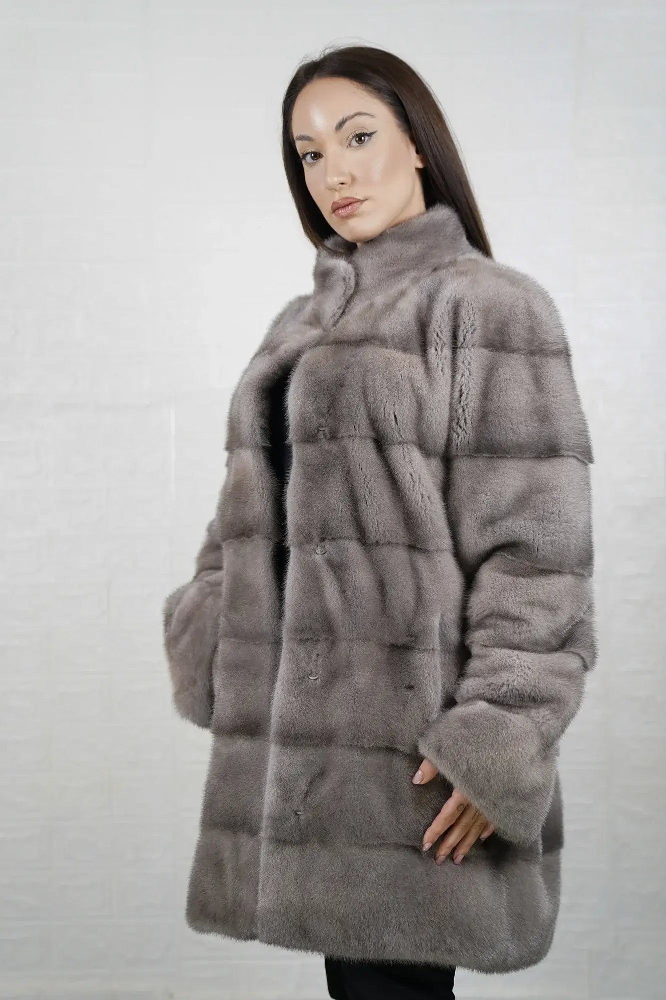Mink fur coat silver close-up texture showing skin on skin pelt flow and cool luminous silver mink depth — Greek craftsmanship, TatiFurs
